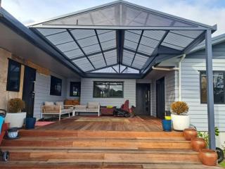 Custom gable awning complementing the architecture of a house