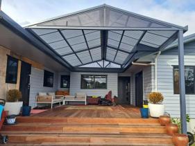 Custom gable awning complementing the architecture of a house